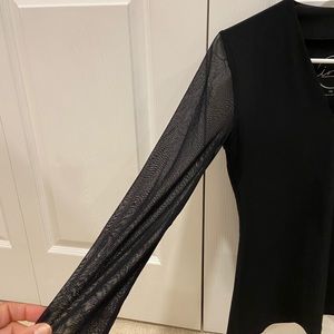 Black v neck INC top. Sheer sleeves. Petite